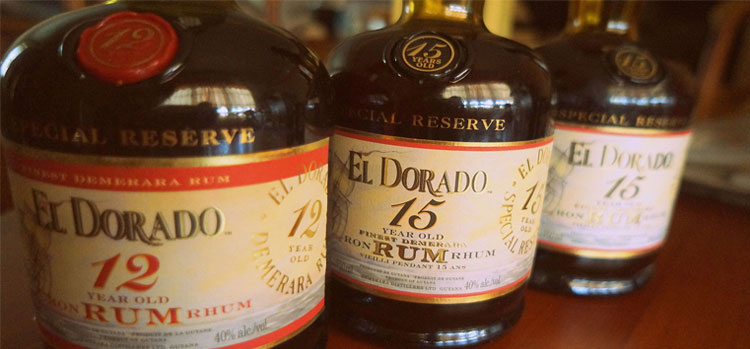 Three bottles of El Dorado Special Reserve Rum, including 12 and 15-year variations with gold labels.
