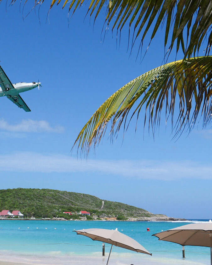 Tradewind Pilatus PC-12 flying over the beaches of St Barths island
