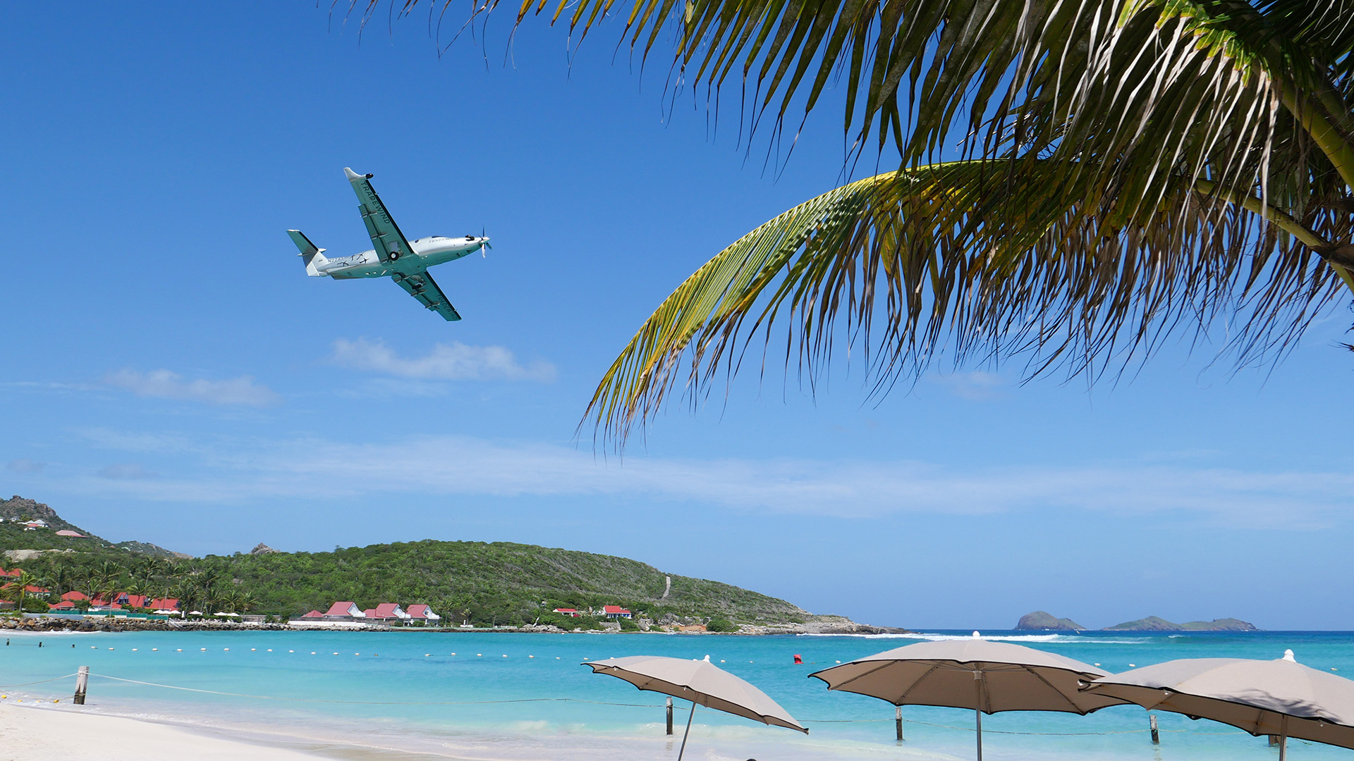 Tradewind Pilatus PC-12 flying over the beaches of St Barths island