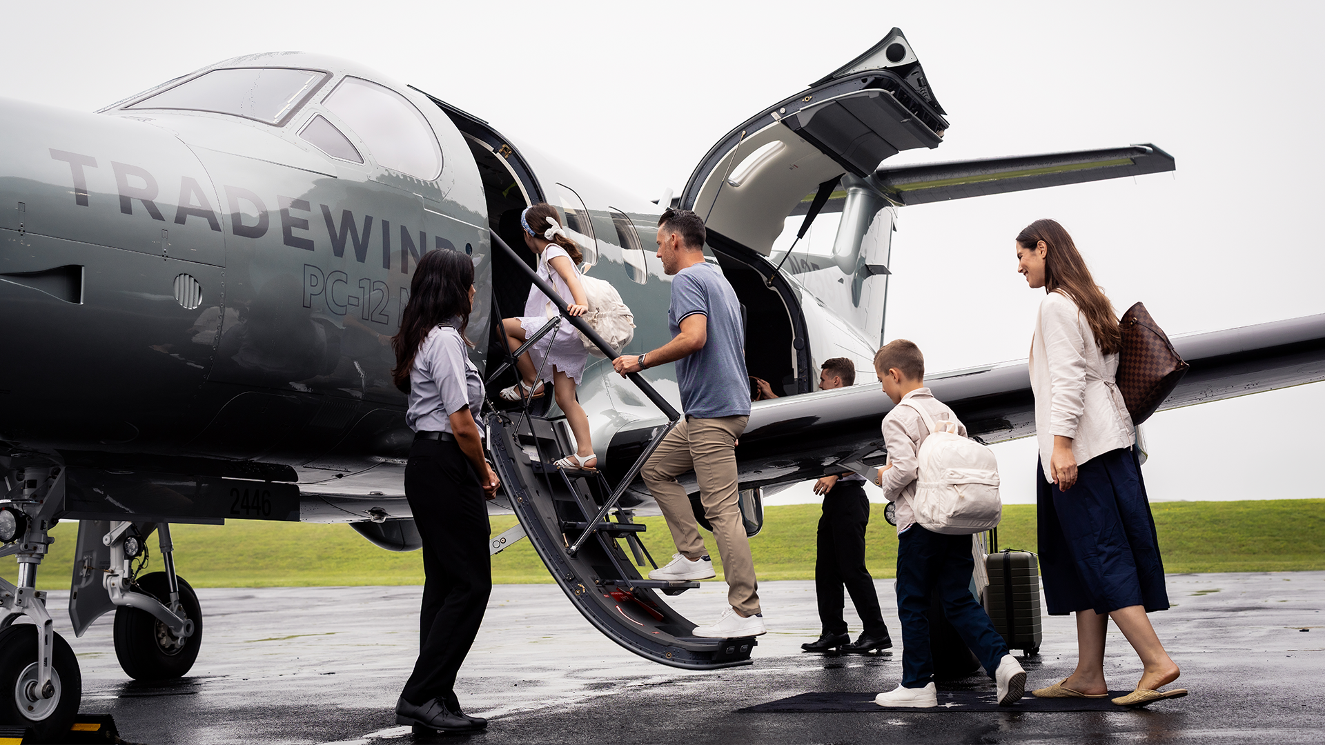 A family boarding a Tradewind plane showing how to get to Nantucket